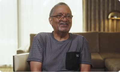 Bryan sitting in a chair